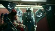 Suicide Squad Kill the Justice League Harley Quinn uses Batwing and Batman's grapple gun. (Image via YouTube Playstation||Warner Bros. Games)